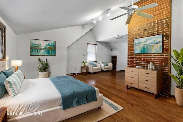 1054 Highland Dr, Columbus, OH 43220 - bedroom featuring lofted ceiling, wood finished floors, ceiling fan, and rail lighting