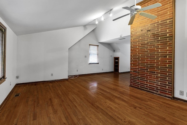1054 Highland Dr, Columbus, OH 43220 - unfurnished living room featuring vaulted ceiling, wood finished floors, a ceiling fan, and rail lighting