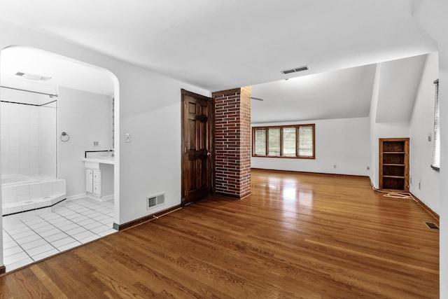 1054 Highland Dr, Columbus, OH 43220 - unfurnished living room with wood finished floors and baseboards
