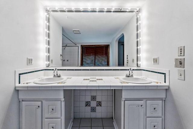 1054 Highland Dr, Columbus, OH 43220 - bathroom with double vanity and tile patterned floors