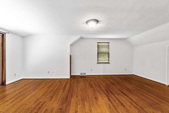 1054 Highland Dr, Columbus, OH 43220 - bonus room featuring wood finished floors and vaulted ceiling