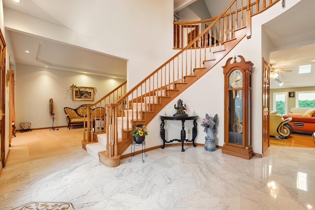 1515 Oak Run Ct, Mansfield, OH 44906 - staircase featuring marble tiled floors, a towering ceiling, and recessed lighting
