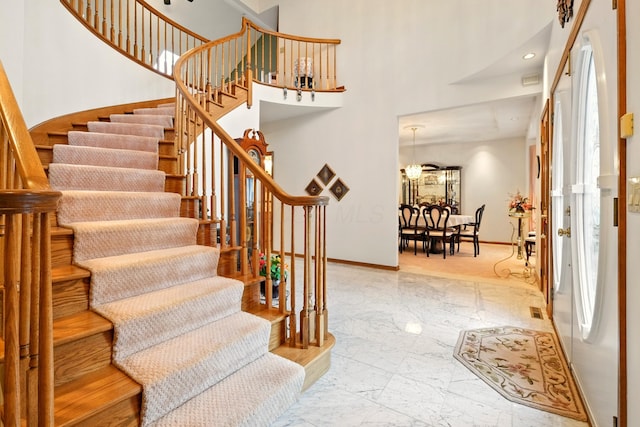 1515 Oak Run Ct, Mansfield, OH 44906 - foyer entrance featuring stairs, marble finish flooring, a high ceiling, and recessed lighting