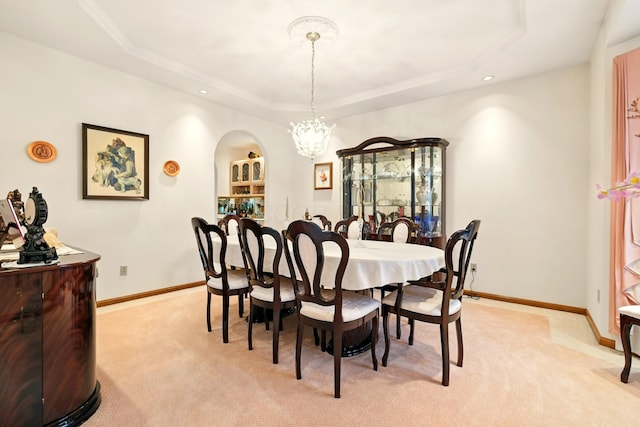1515 Oak Run Ct, Mansfield, OH 44906 - dining room with light carpet, a tray ceiling, a chandelier, arched walkways, and recessed lighting