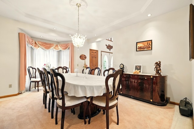 1515 Oak Run Ct, Mansfield, OH 44906 - dining space featuring recessed lighting, a tray ceiling, light colored carpet, a chandelier, and crown molding