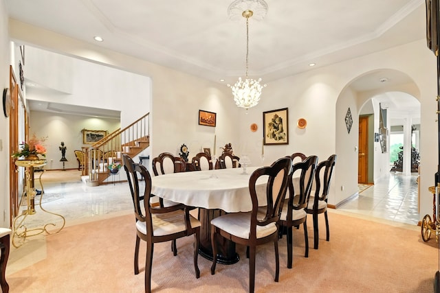 1515 Oak Run Ct, Mansfield, OH 44906 - dining area with light colored carpet, recessed lighting, a tray ceiling, stairs, and arched walkways