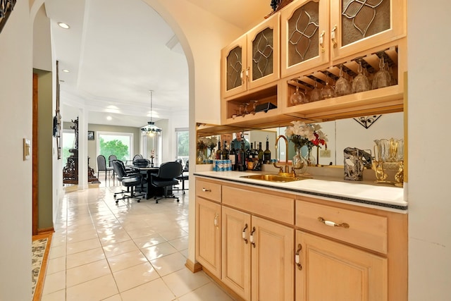 1515 Oak Run Ct, Mansfield, OH 44906 - indoor bar featuring arched walkways, light tile patterned floors, crown molding, and recessed lighting