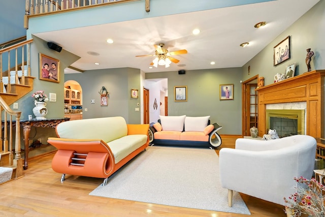 1515 Oak Run Ct, Mansfield, OH 44906 - living area featuring stairs, wood finished floors, a high end fireplace, ceiling fan, and recessed lighting