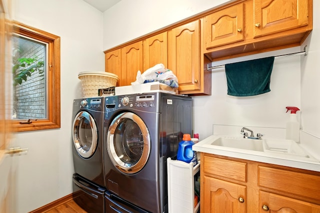 1515 Oak Run Ct, Mansfield, OH 44906 - laundry room with separate washer and dryer, cabinet space, and wood finished floors