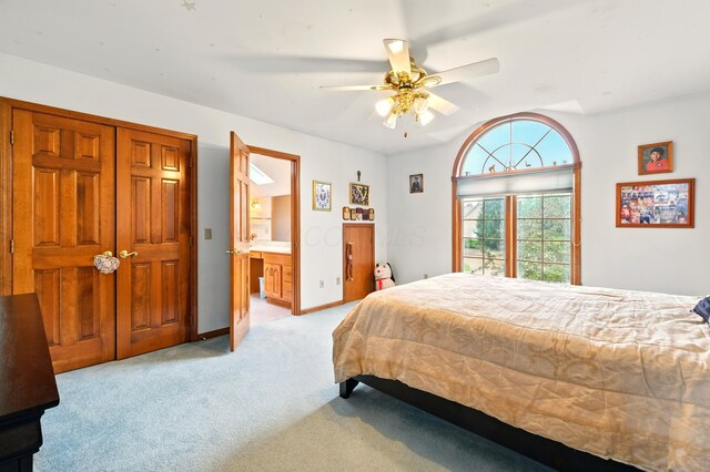 1515 Oak Run Ct, Mansfield, OH 44906 - bedroom with light colored carpet, ensuite bath, and a ceiling fan
