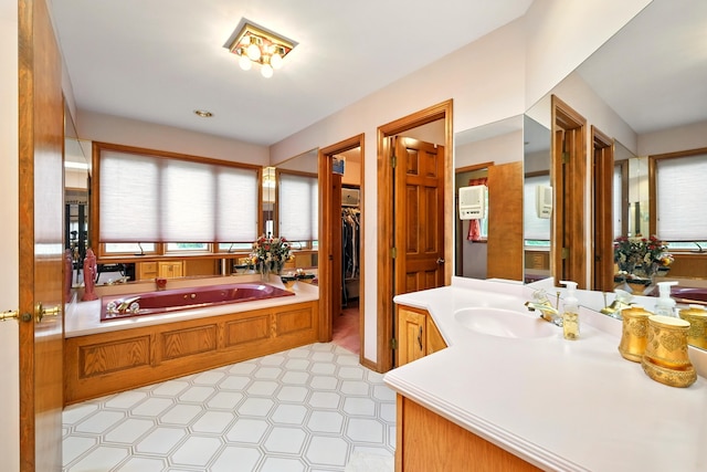 1515 Oak Run Ct, Mansfield, OH 44906 - full bath featuring vanity, a garden tub, and a spacious closet