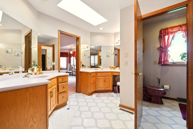 1515 Oak Run Ct, Mansfield, OH 44906 - bathroom with vanity, a skylight, and recessed lighting