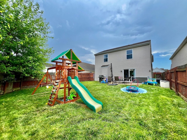 6871 Manor Crest Ln, Canal Winchester, OH 43110 - back of house with a playground and a fenced backyard