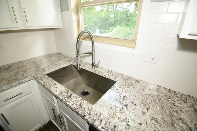 3565 Motts Place Ct, Canal Winchester, OH 43110 - kitchen featuring decorative backsplash, light stone counters, and white cabinetry