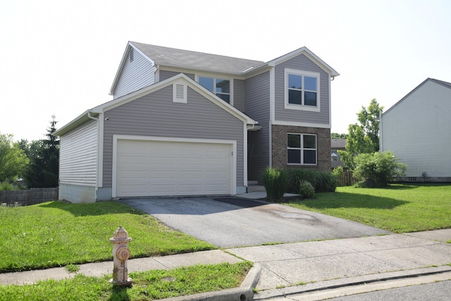 3434 Royal Hill Dr, Columbus, OH 43223 - traditional home with driveway, a garage, a front lawn, and brick siding