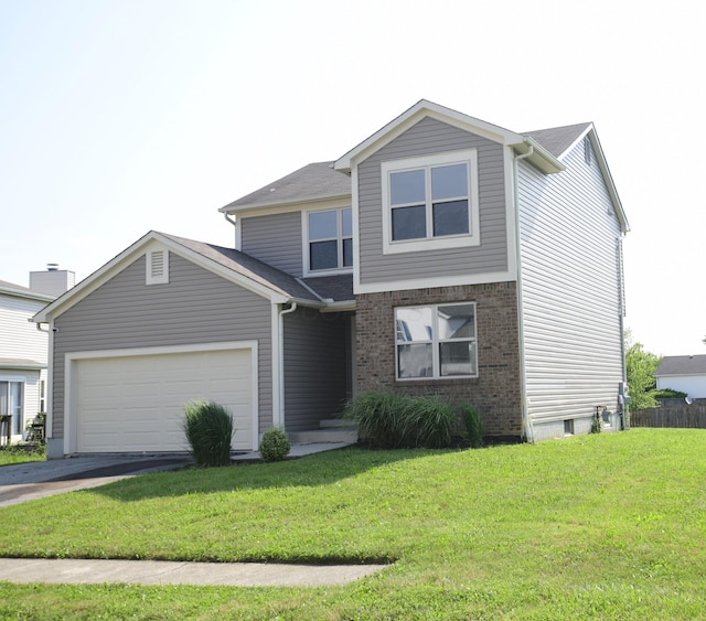 3434 Royal Hill Dr, Columbus, OH 43223 - traditional home featuring a garage, driveway, and brick siding