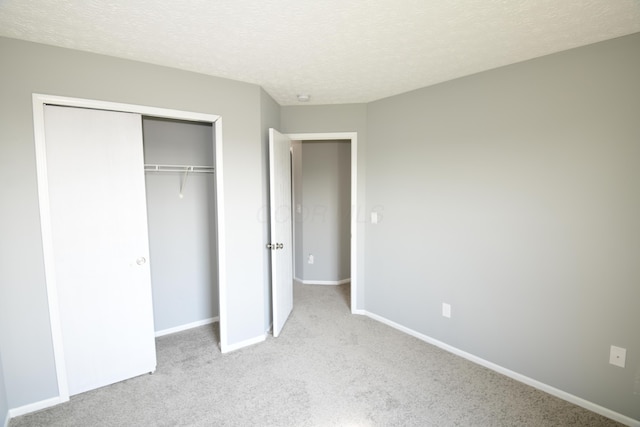 3434 Royal Hill Dr, Columbus, OH 43223 - unfurnished bedroom with a closet, carpet floors, and a textured ceiling
