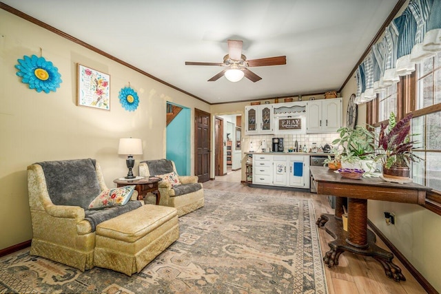 537 Dunkle Rd, Circleville, OH 43113 - living room featuring light wood finished floors, a ceiling fan, and ornamental molding