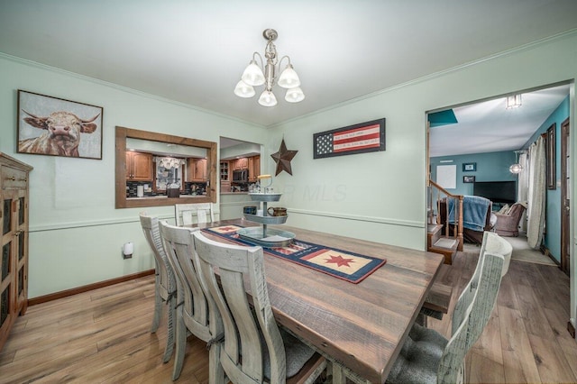 537 Dunkle Rd, Circleville, OH 43113 - dining room featuring a chandelier, light wood-type flooring, and crown molding