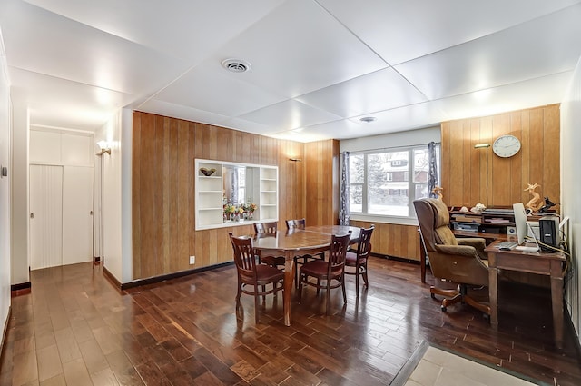 1919 Oakland Pkwy, Lima, OH 45805 - dining space featuring wood walls, dark wood finished floors, and built in features