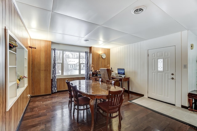 1919 Oakland Pkwy, Lima, OH 45805 - dining area with wood-type flooring and wooden walls