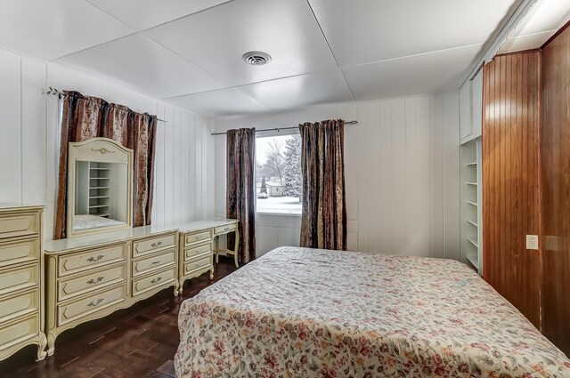 1919 Oakland Pkwy, Lima, OH 45805 - bedroom with dark wood finished floors and wooden walls