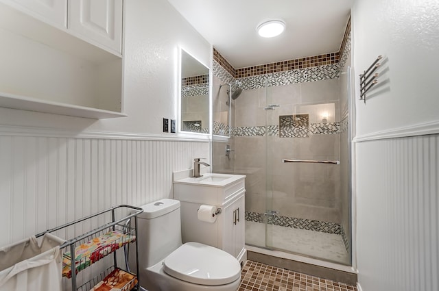 1919 Oakland Pkwy, Lima, OH 45805 - bathroom featuring a stall shower, vanity, and a wainscoted wall