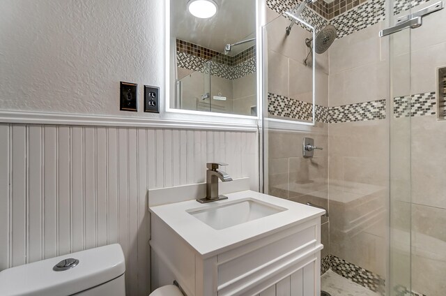 1919 Oakland Pkwy, Lima, OH 45805 - bathroom featuring a shower stall, vanity, and wainscoting