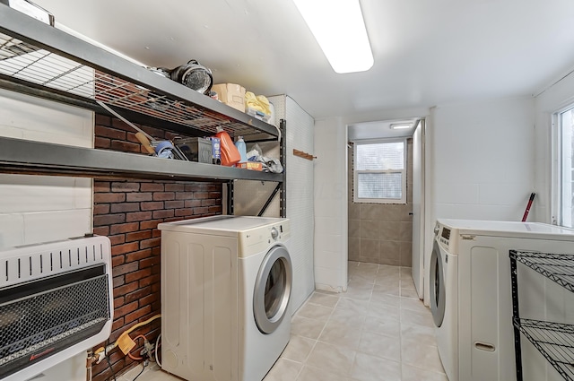 1919 Oakland Pkwy, Lima, OH 45805 - laundry area featuring separate washer and dryer, light tile patterned floors, and heating unit