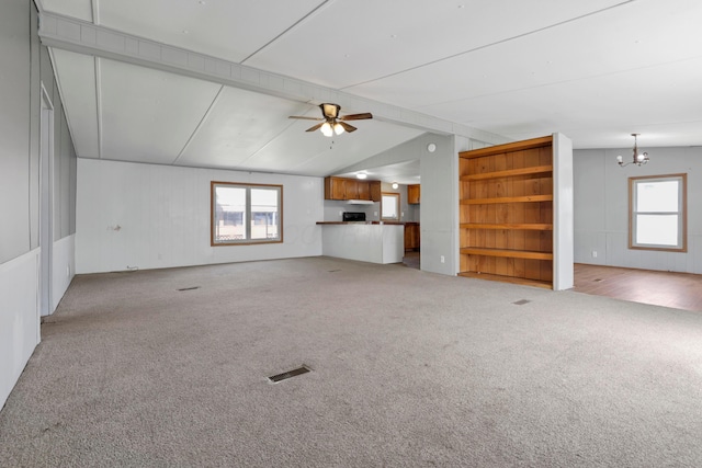 264 Timberline Dr, Circleville, OH 43113 - unfurnished living room with carpet floors, a chandelier, ceiling fan, healthy amount of natural light, and lofted ceiling