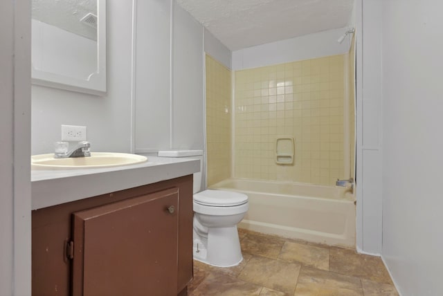 264 Timberline Dr, Circleville, OH 43113 - full bath with vanity, washtub / shower combination, stone finish floors, and a textured ceiling
