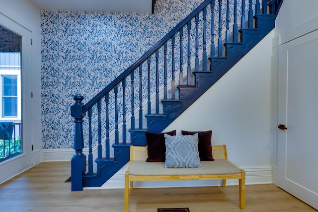 1017 Madison Ave, Columbus, OH 43205 - stairway featuring wallpapered walls and wood finished floors