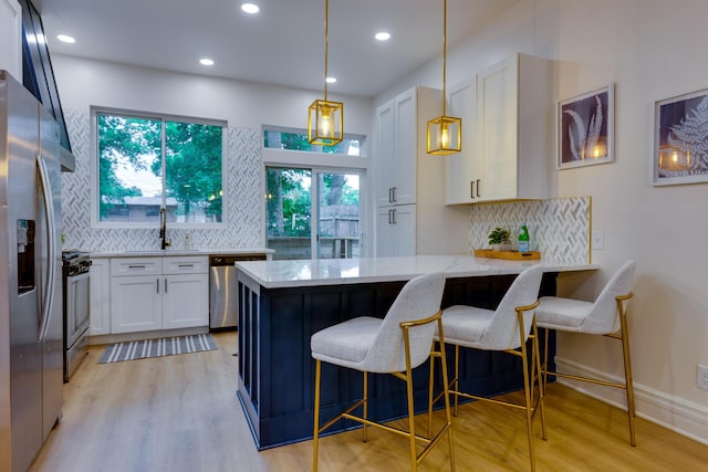 1017 Madison Ave, Columbus, OH 43205 - kitchen featuring stainless steel appliances, white cabinetry, tasteful backsplash, and recessed lighting