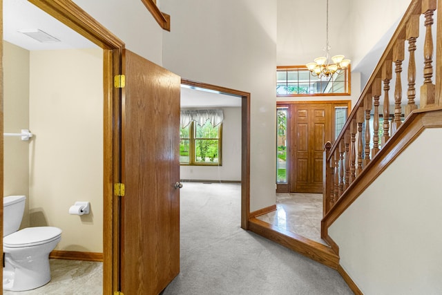 4775 Saint Andrews Dr, Westerville, OH 43082 - entryway with a chandelier, carpet flooring, stairway, and a high ceiling