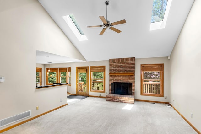 4775 Saint Andrews Dr, Westerville, OH 43082 - unfurnished living room featuring a skylight, high vaulted ceiling, carpet floors, and a fireplace
