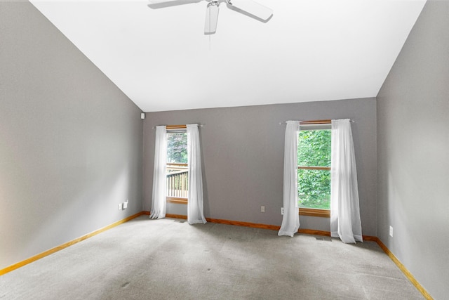 4775 Saint Andrews Dr, Westerville, OH 43082 - carpeted empty room featuring plenty of natural light, lofted ceiling, and ceiling fan