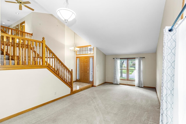 4775 Saint Andrews Dr, Westerville, OH 43082 - unfurnished living room featuring carpet, stairway, a chandelier, a ceiling fan, and high vaulted ceiling