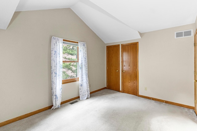 4775 Saint Andrews Dr, Westerville, OH 43082 - unfurnished bedroom with vaulted ceiling and light colored carpet