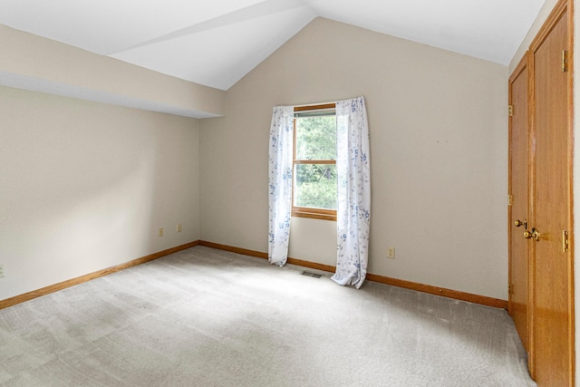 4775 Saint Andrews Dr, Westerville, OH 43082 - unfurnished bedroom with lofted ceiling and light carpet