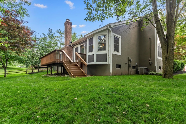 4775 Saint Andrews Dr, Westerville, OH 43082 - rear view of property featuring stucco siding, a deck, stairway, and a chimney