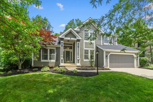 4775 Saint Andrews Dr, Westerville, OH 43082 - view of front of home with concrete driveway, a front yard, and an attached garage