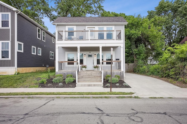 1366 Cole St, Columbus, OH 43205 - multi unit property with a balcony, covered porch, driveway, and roof with shingles