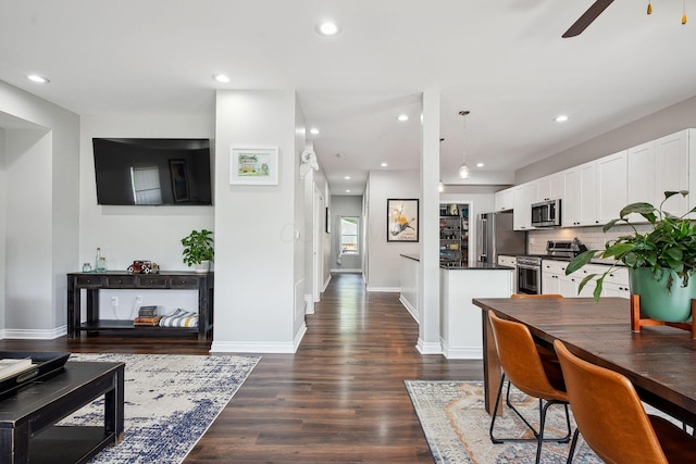 1366 Cole St, Columbus, OH 43205 - dining room with dark wood-style flooring, a ceiling fan, and recessed lighting