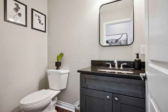1366 Cole St, Columbus, OH 43205 - bathroom featuring vanity and wood finished floors