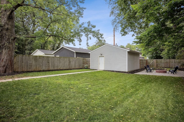 1366 Cole St, Columbus, OH 43205 - fenced backyard featuring an outdoor fire pit, an outbuilding, and a patio area