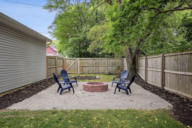 1366 Cole St, Columbus, OH 43205 - fenced backyard featuring an outdoor fire pit and a patio