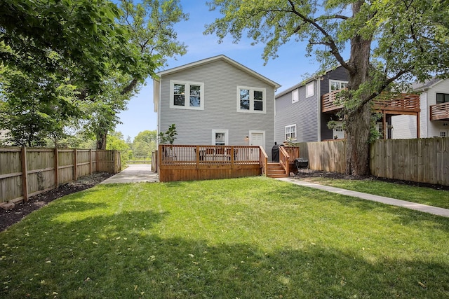 1366 Cole St, Columbus, OH 43205 - back of property with a fenced backyard and a wooden deck