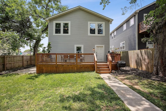 1366 Cole St, Columbus, OH 43205 - back of property with a fenced backyard and a wooden deck