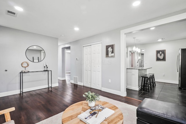 4425 Saint Ann Ln, Columbus, OH 43213 - living area featuring recessed lighting, dark wood-type flooring, and a chandelier
