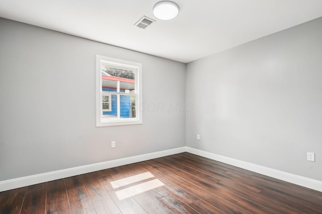 4425 Saint Ann Ln, Columbus, OH 43213 - unfurnished room featuring baseboards and dark wood-style floors
